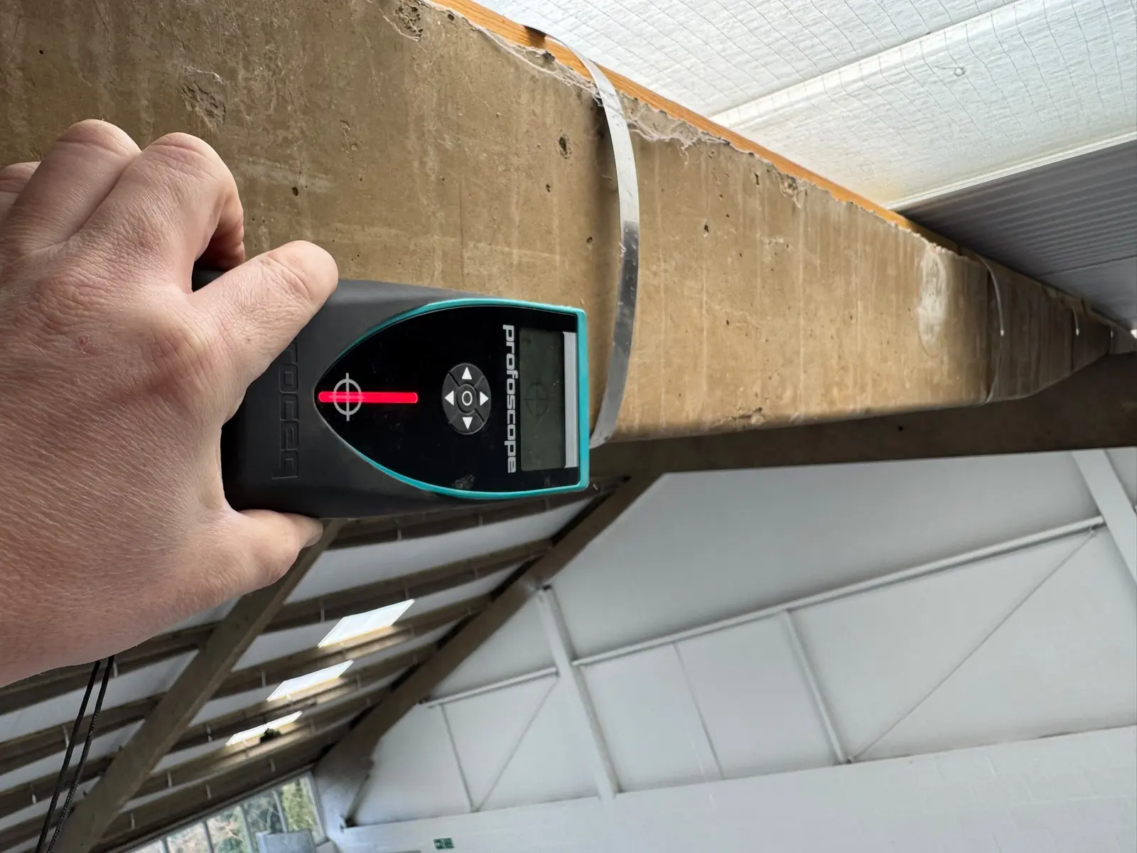 Cover meter reading taken on the side of a concrete beam