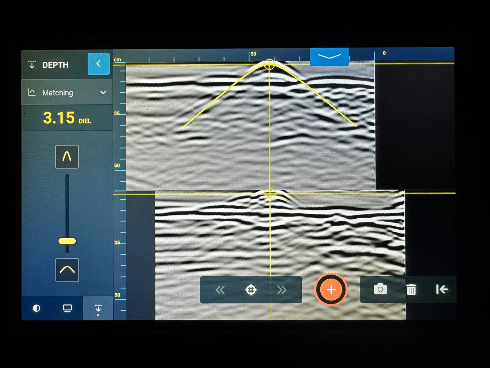 Ground penetrating radar trace with a hyperbola fitted to a reinforcing bar reflection