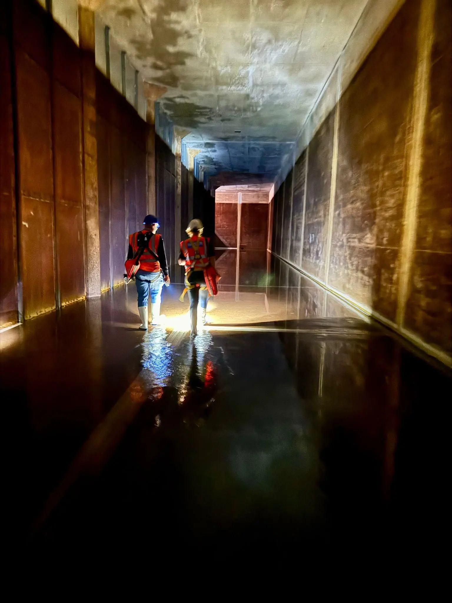 Interior of a drained water tank during an inspection